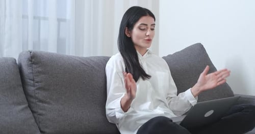 Woman Talking on Video Call at Home