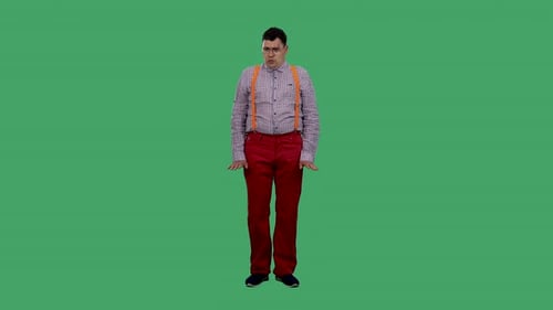 Man Gesturing Expressively on a Green Screen