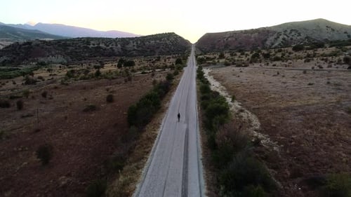 Man Walking A Rural Road