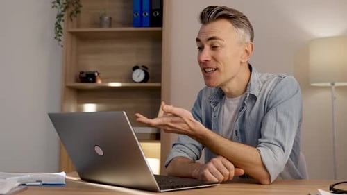 Smiling Man Having a Video Call on Laptop