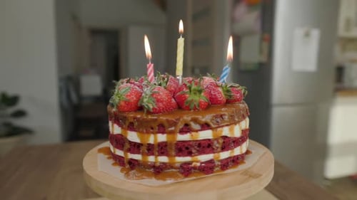 Delicious Birthday Cake with Strawberries and Candles