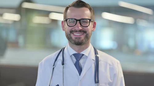 Smiling Male Doctor with Stethoscope and Glasses