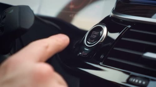 Starting car engine. Finger press the button to start the car engine. Power