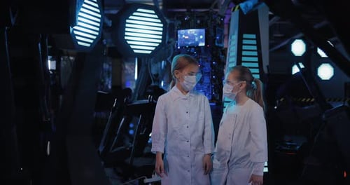 Girls in Lab Coats in Futuristic Laboratory