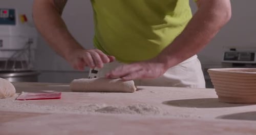 Baker Shaping Bread Dough by Hand
