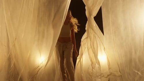 Professional Dancer Performing in Studio in Soft Warm Lighting