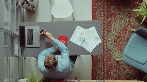 Multiethnic Coworkers Meeting in Office and Drinking Coffee