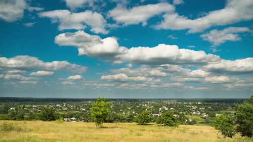 Landscape Fields and Moving Clouds in Blue Sky. Timelapse. Amazing Rural Valley. Ukraine