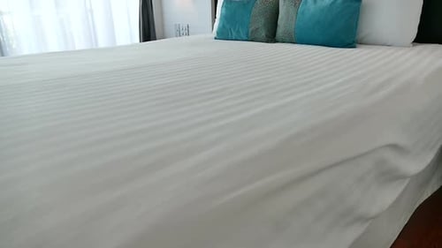 Hotel Room Bed with Turquoise Pillows, Interior Design