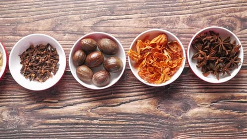 Assorted Colorful Spices in Bowls on Wooden Table