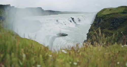 Scenic Waterfall Flowing in a Lush Landscape