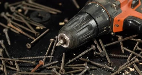 Drill with Screws in a Close-Up Shot