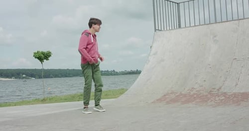 Young Man Warming Up in Urban Park