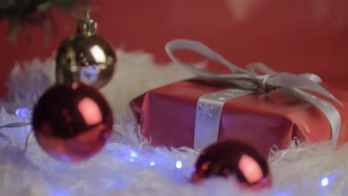 Red Christmas Gift with Ornaments and Lights