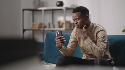 Young Adult Chatting on Video Call at Home