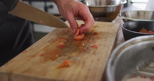 Caucasian male chef cutting vegetables