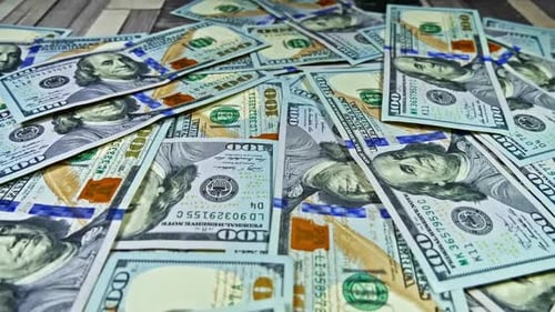 Pile of one hundred dollar bills in close up