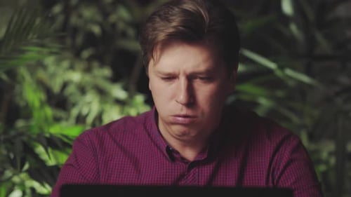 Young Adult Working on Laptop at Night