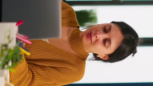 Woman Works at Computer in Vertical Video
