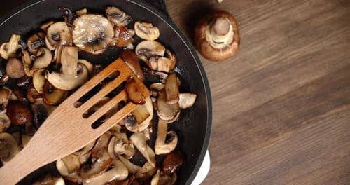 Roasted Mushrooms in a Frying Pan Slowly Rotate