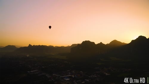 Sunrise Over Exotic Mountains with Hot Air Balloon