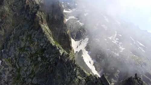 Flight Over Sharp Rocky Mountain Ridge