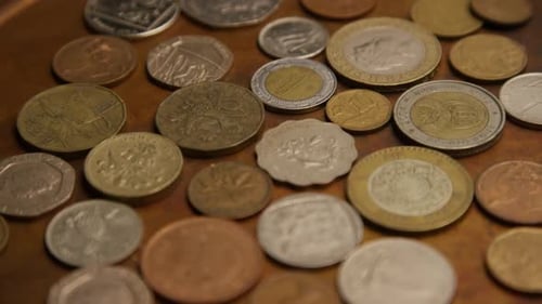 Rotating stock footage shot of international monetary coins - MONEY 0387
