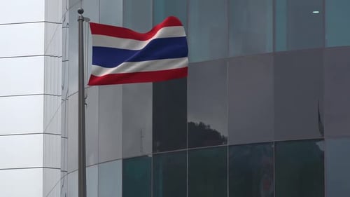 Realistic Waving Flag of Thailand on Modern Corporate Building