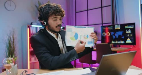 Young Adult Explains Graphs During a Video Call