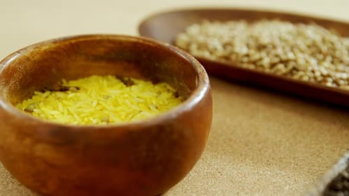 Assorted Spices and Grains in Wooden Bowls