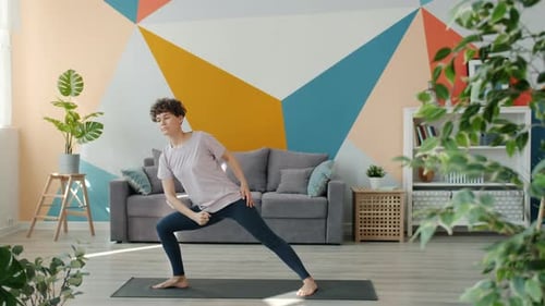 Woman Doing Yoga at Home in Bright Room