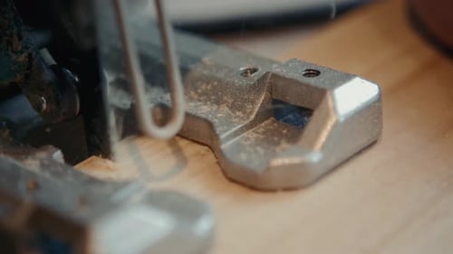 Close Up of Carpenter's Hands Cutting Wood with Table Saw in Workshop, Craftsman Furniture