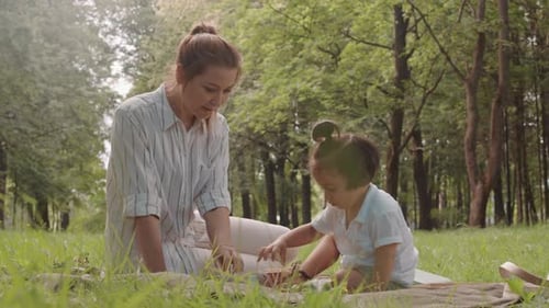 Mother and Child Playing in Urban Park