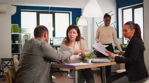 Diverse Businesspeople Brainstorming While Meeting Together at Company Office