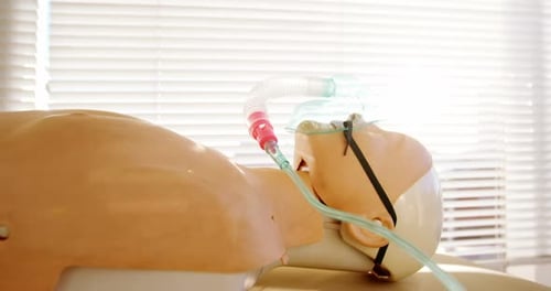 Medical Mannequin with Oxygen Mask Lying Down