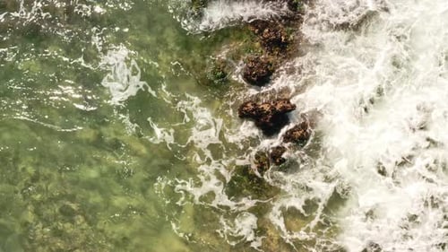 Waves Crashes into the Rocky Shore Mexico