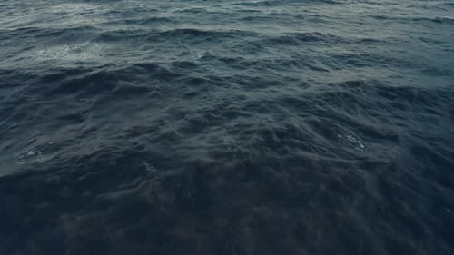 An Aerial Drone View of Cold Ocean Waves in the Evening