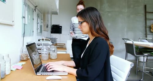 Women Working Together in a Modern Office Space