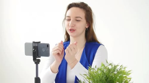 Woman Recording Video on Smartphone