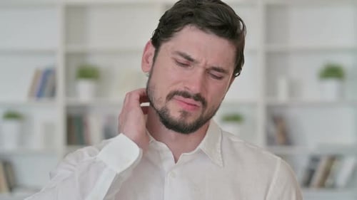 Man with Neck Pain Rubbing Sore Spot