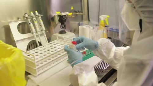 Scientist Handling Test Tube in Secure Lab