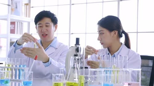Scientists Working with Test Tubes in a Lab
