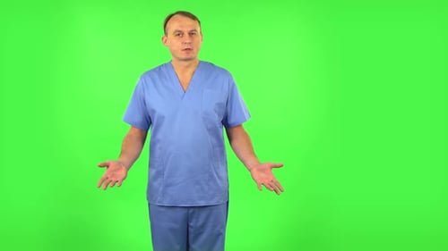 Medical Man Presenting Something. Green Screen