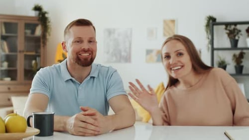 Smiling Couple Video Chatting at Home