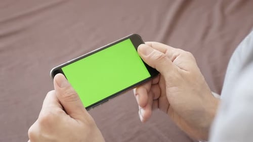 Male holds in hands modern green screen mobile device 4K 2160p 30fps UltraHD footage - Internet su