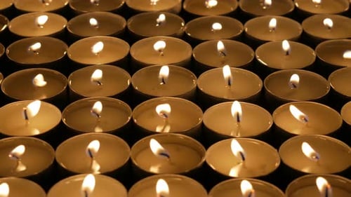 Flickering Candles Glowing in the Darkness