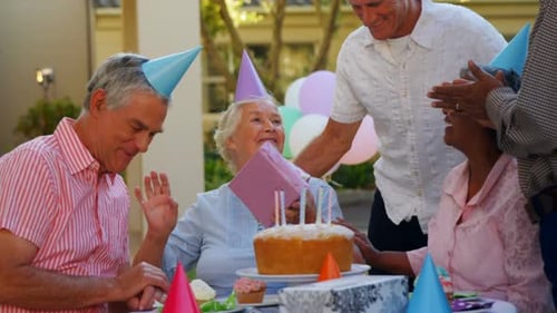 Seniors Celebrating a Birthday Outdoors