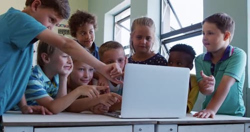 Group of kids using laptop in the class