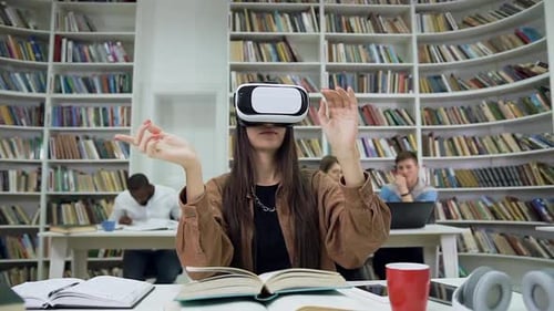 Modern Girl in Augmented Reality Goggles which Sitting in the Library and Reading Book