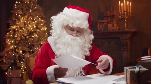 Santa Claus Reading Letters by Christmas Tree